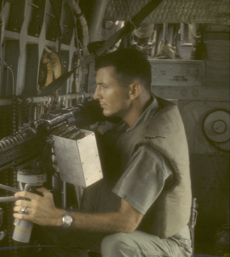 Lt. Holmes at machine gun